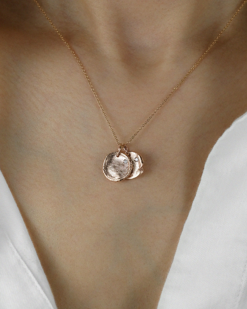 Mini Fingerprint Charm in solid gold with a diamond