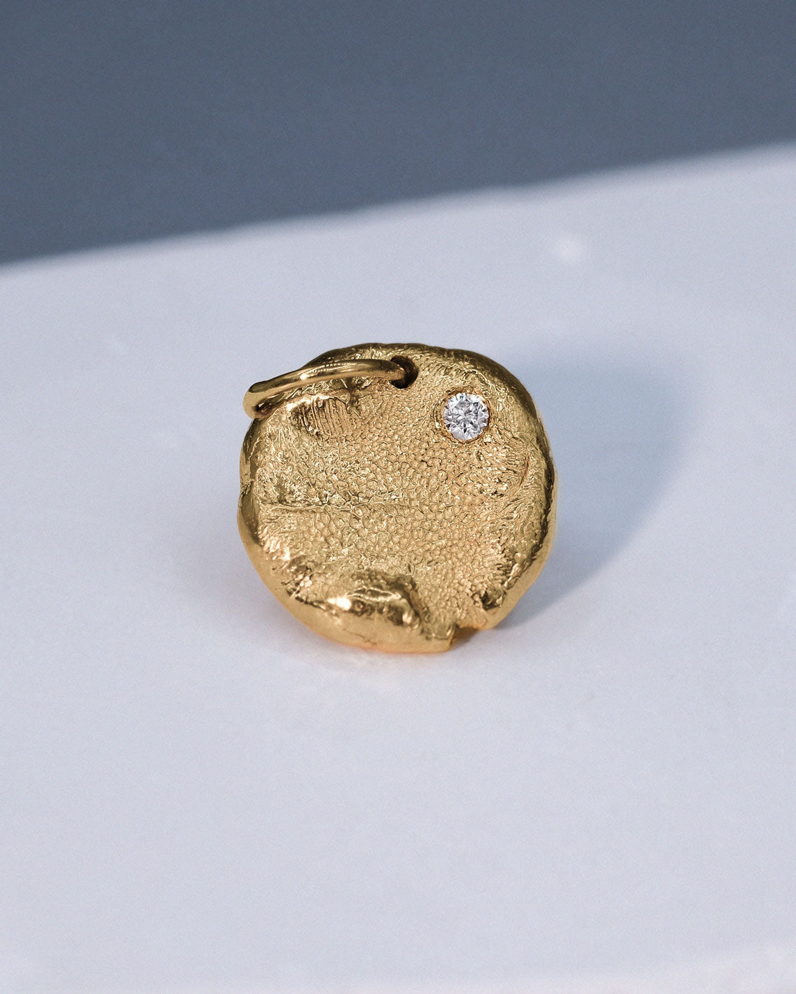 Mini Fingerprint Charm in solid gold with a diamond