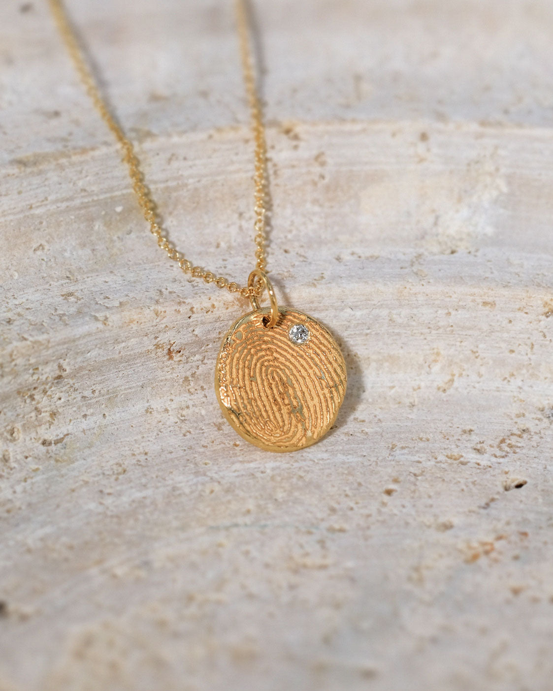 Mini Fingerprint Necklace in solid gold with a Diamond